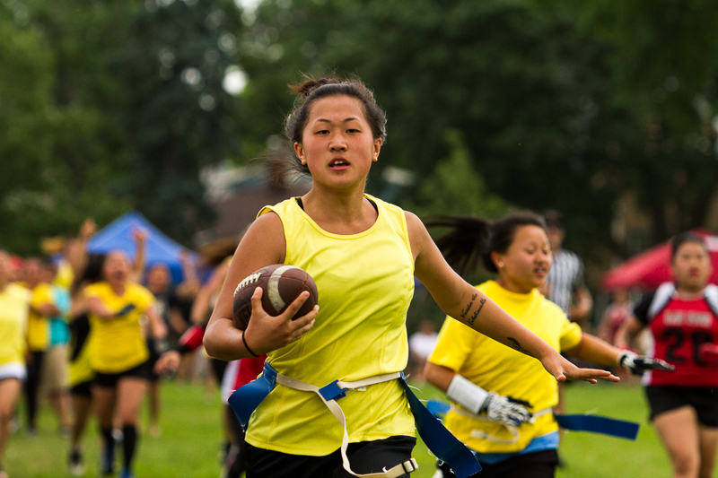 Ester Vang scores for the Showrens team at the female's flag football game. The team lost the game 27-1 eventually. 